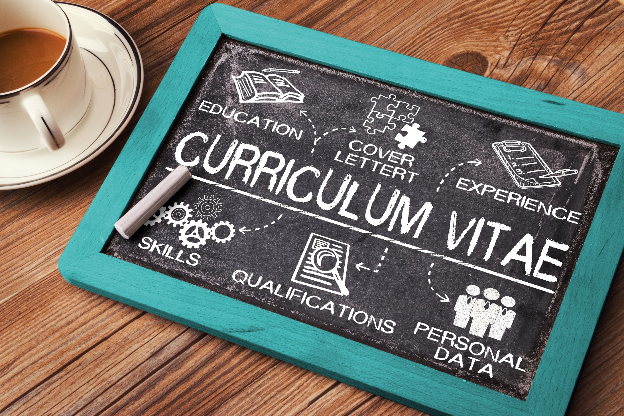 Photo of curriculum vitae and laptop