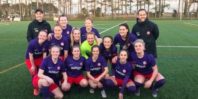 Wymondham Town Football Club Ladies 1st Team group shot of them celebrating their semi final win